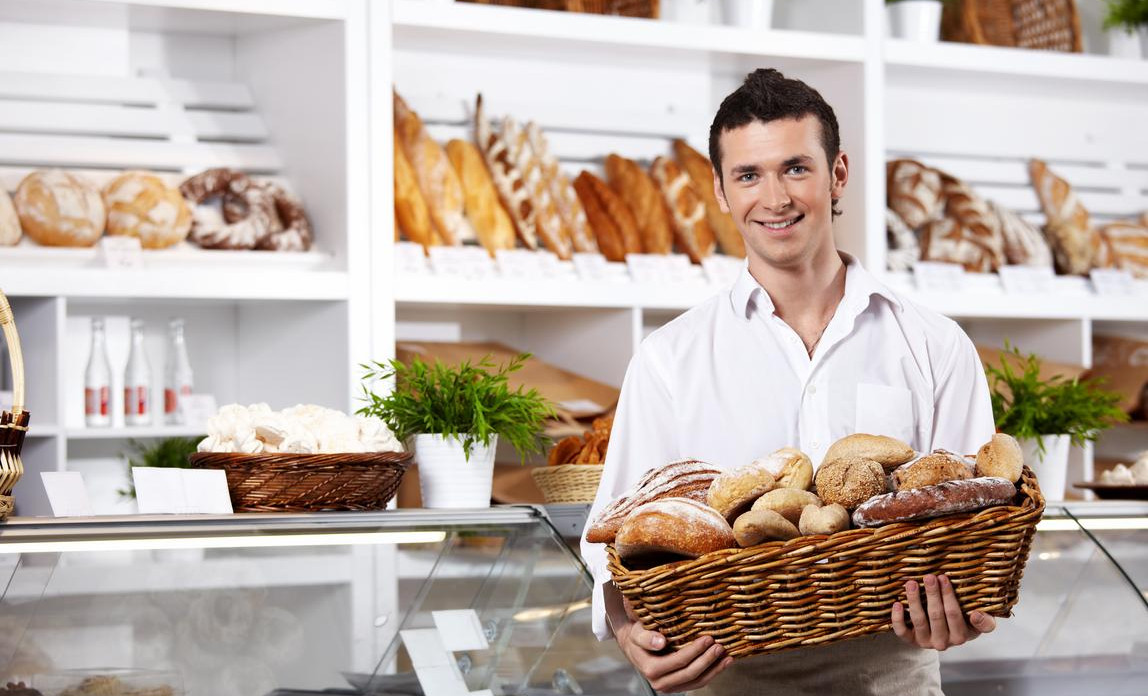 Premium AI Image  A baker in a bakery is making bread.