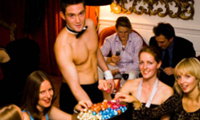Topless man serving women at a party