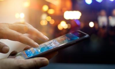 A man is usning an app on his phone
