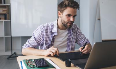 A man uses practical small business tools to save time and effort
