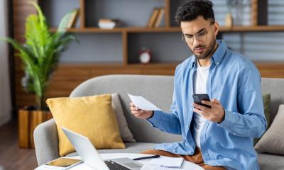 A man receives a letter from HMRC about the income from his side hustle