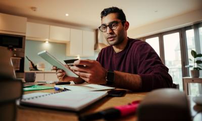 Businessman working out his income tax after Making Tax Digital implementation