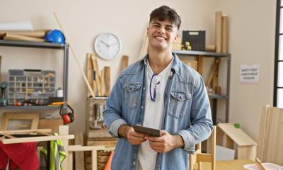 A young businessman uses accounting software to save time and money