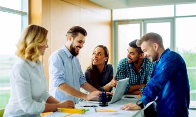 A group of business colleagues discuss how to market their start-up venture.