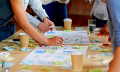 A group of people working on a business plan