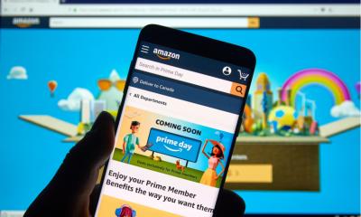 Close up shot of Amazon prime on a mobile overlayed by Amazon on a desktop