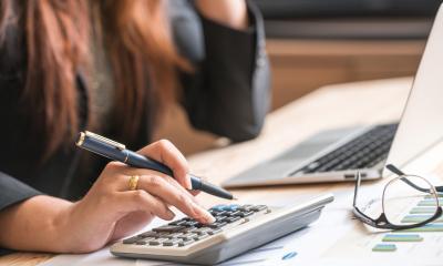 Being a treasurer Volunteer using calculator to manage finances