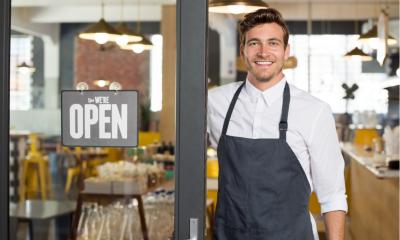 A man outside his food-based business