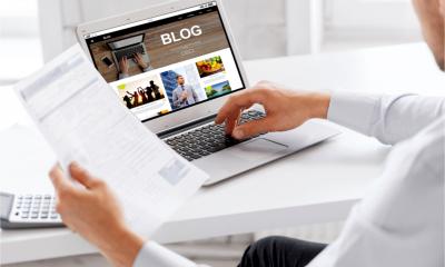 A copywriter updates a business blogfeed with a new blog post