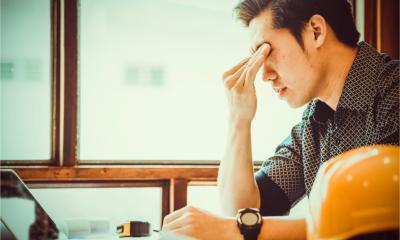 A construction site manager struggles with the pressure and stress of work