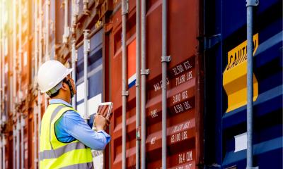 A port controller inspects shipping containers