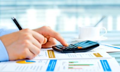 Budgeting Businessperson performing budget calculations