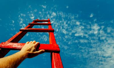 An entrepreneur climbs a ladder
