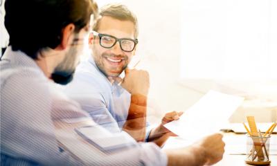 Smiling man during business meeting with his co-founder