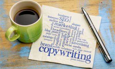 Copywriting word cloud - handwriting on a napkin with a cup of coffee.