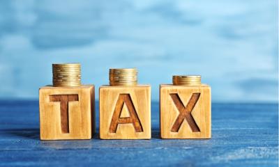 Wooden cubes with "tax" letters on them