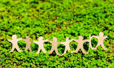 Human chain paper on green creeper plant to represent CSR (corporate social responsibility)