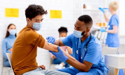 An employee gets his COVID vacination