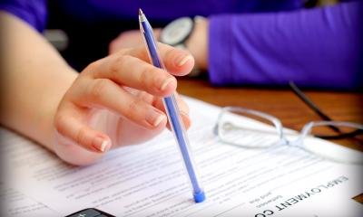Drawing up an employment contract - checklist An HR manager checks all the terms and conditions on a draft employment contract