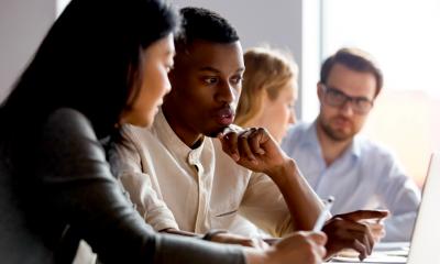 A team receives training from a work coach