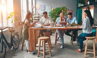 A group of business people work together in a modern office.