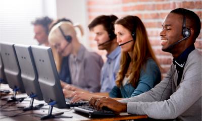 Young call centre team talking with customers