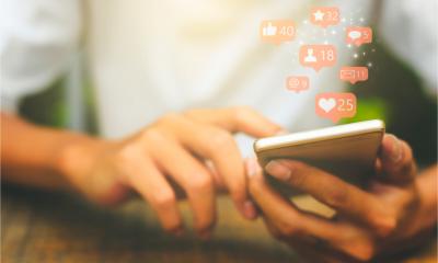 Young man using smart phone - social media concept.