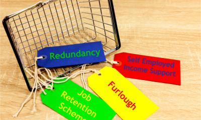 Sjopping basket containing labels with the different job support schemes in place during COVID-19