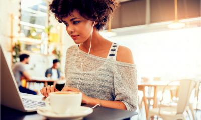 A successful blogger works from a coffee shop and earns money from sponsored posts.