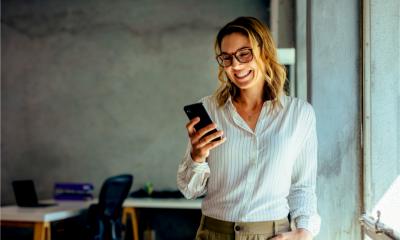 A happy woman receives notification she has won a governement contract