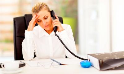 Serious businesswoman talking on phone Serious businesswoman talking on phone