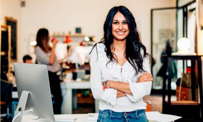 A smiling woman is glad she has saved time and money with great small business apps