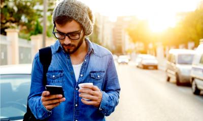 A man reads a marketing email on his phone