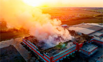Heavy smoke from a burning industrial distribution warehouse or storehouse