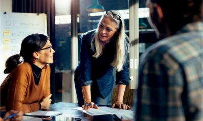 An interim manager works with a group of employees