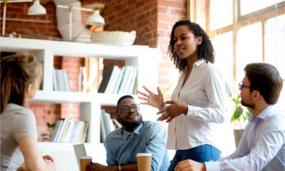 A female boss talks to her team about a new project