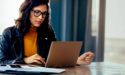 Self-employed woman looks online for COVID-19 support