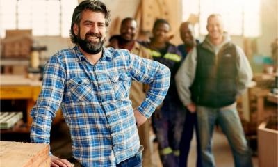 A carpenter with his team