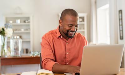 An employee happily works from home during lockdown