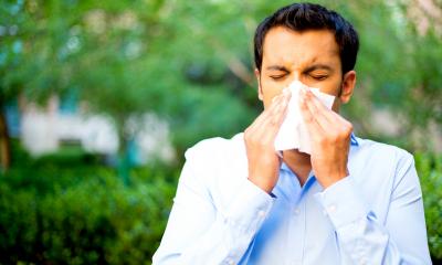 Managing absenteeism - checklist man sneezing into tissue