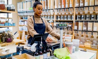 A woman works in her zero packaging shop