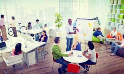 Colorful sunny office in a high rise building with a view of the city