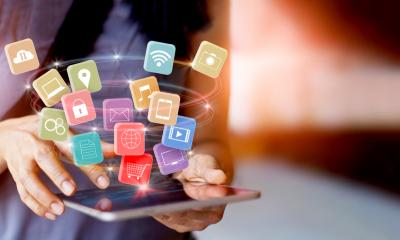 A woman uses a tablet to access an omnichannel marketing campaign