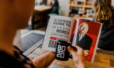 Man reading a book on personal development