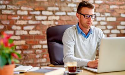 A man works from his home office