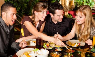 Group of friends having dinner at Chinese restaurant