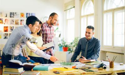 A small business marketing business team plan their strategy