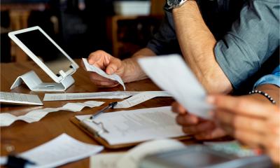A business couple go through their expense receipts to work out which expenses are allowable