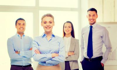 A group of company directors pose for a photograph