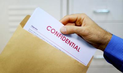 A man is about to read a non-disclosure agreement